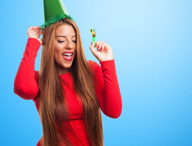 Woman with green hat dancing