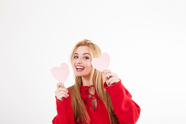 Free photo woman with hearts looking at camera