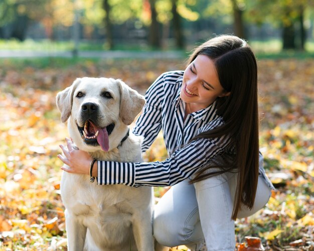 Woman with her canine in the park