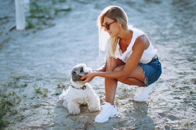 Woman with her dog on a vacation