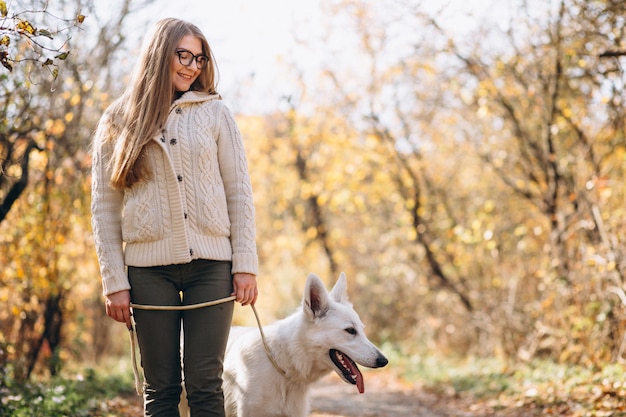 Woman with her dog walking in park