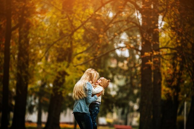 Woman with her little daughter in arms