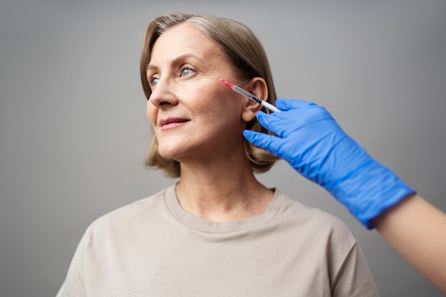 Woman with hyaluronic acid injection medium shot