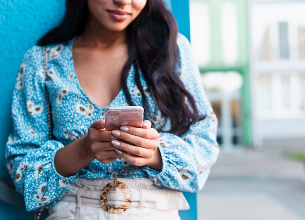 Free Photo woman with long hair using her phone 