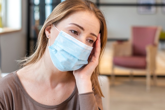 Woman with mask staying in quarantine portrait