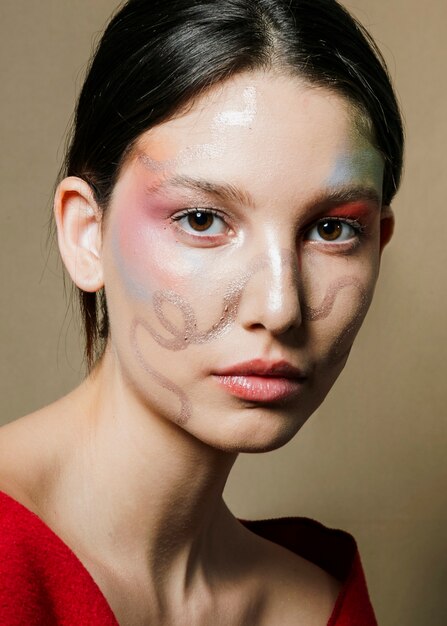 Woman with painted face posing