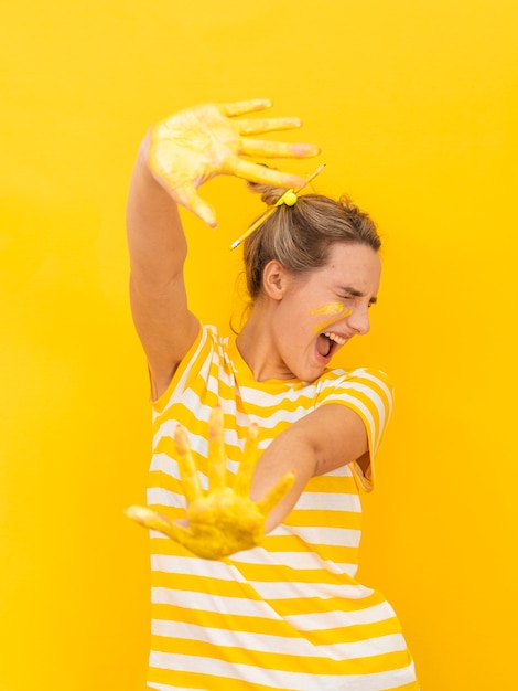 Woman with painted hands being scared