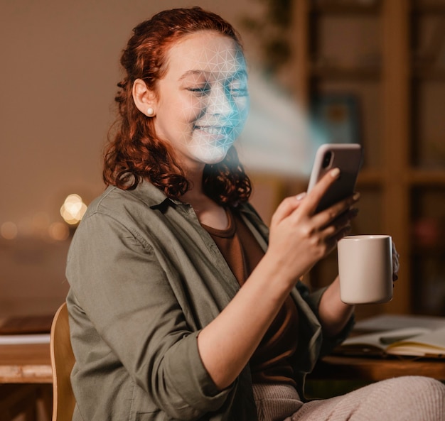 Free photo woman with phone doing face scan