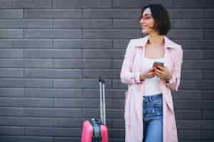 Free photo woman with phone travelling