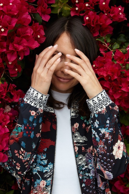 Free Photo woman with the red flowers posing