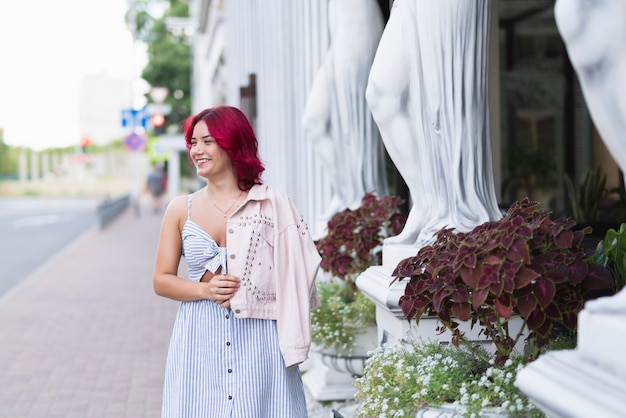 Free Photo woman with red hair and flowers