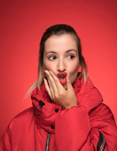 Free photo woman with red winter coat