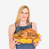 Free photo woman with roasted turkey in glassware