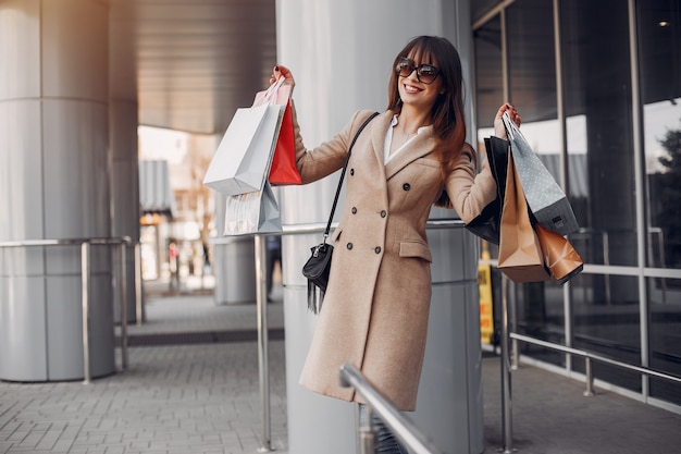 Woman with shopping bag in a city