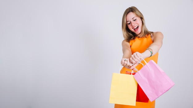 Woman with shopping bags and space on left