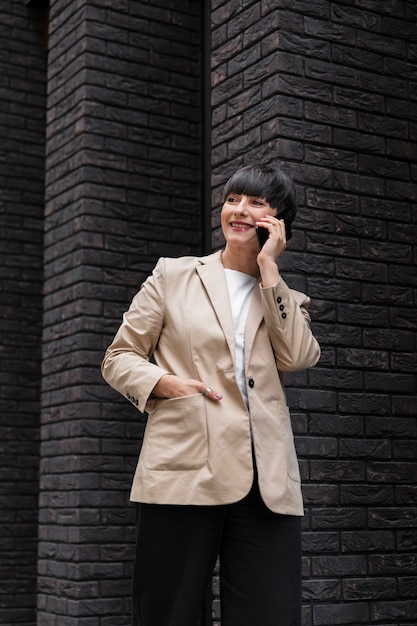 Free Photo woman with short hair talking on the phone