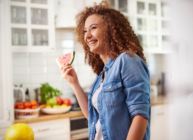 Free photo woman with a slice of watermelon