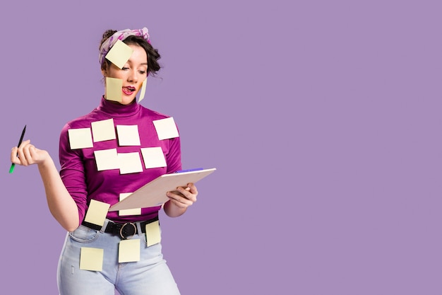 Free Photo woman with sticky notes on her and copy space