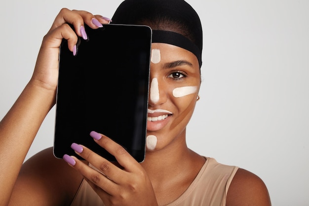 Woman with a tablet covered half of a face