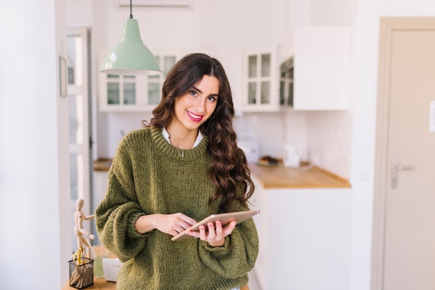 Free Photo woman with tablet looking at camera