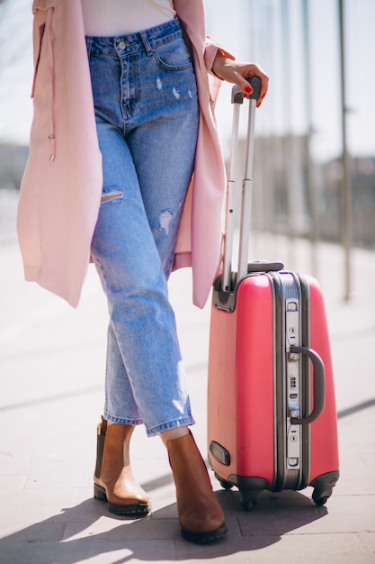 Free Photo woman with travelling bag