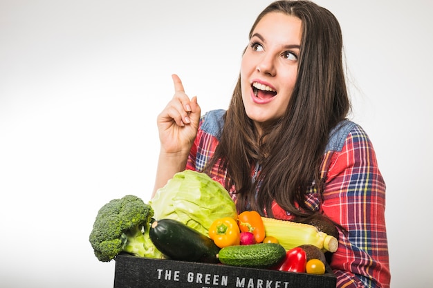 Woman with vegetables having idea