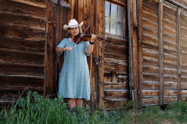 Free Photo woman with violine getting ready for country music concert