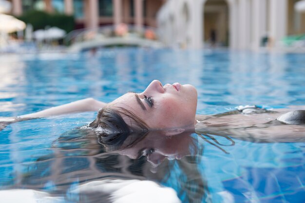 Woman with whole body immersed less face