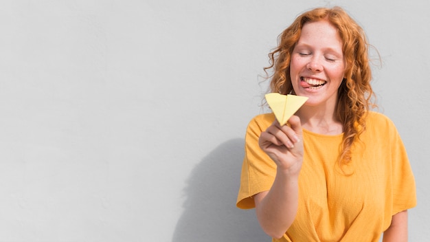 Woman with yellow dress and plane