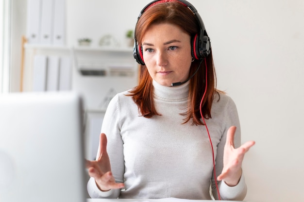 Free photo woman at work having video call