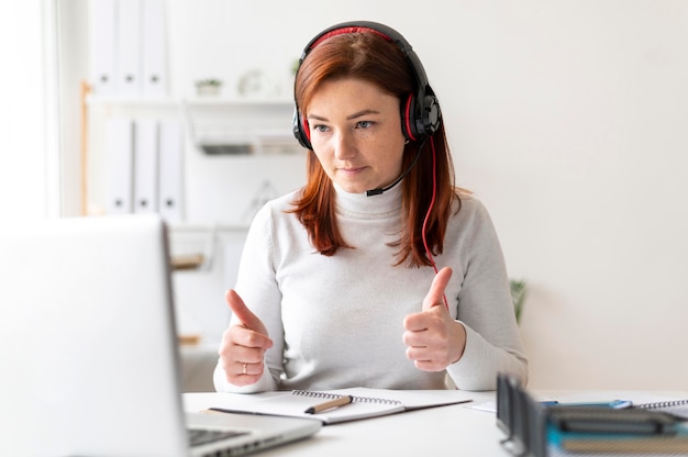 Free photo woman at work having video call