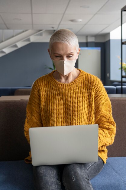 Woman at work wearing a medical mask