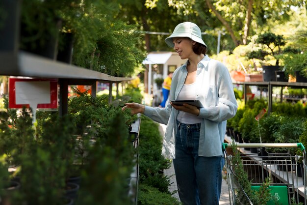 Woman working alone in a sustainable greenhouse