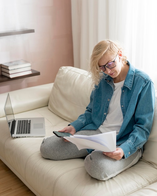 Free Photo woman working on couch