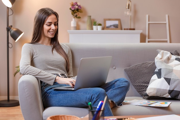 Woman working from a comfortable couch