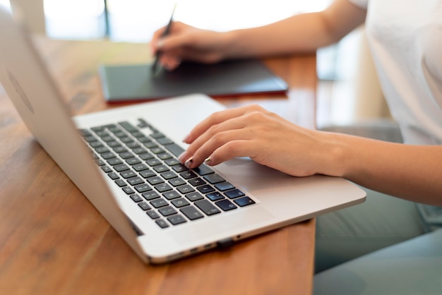 Woman working from home for social distancing with laptop