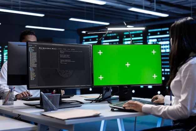 Free Photo woman working on green screen pc in data center