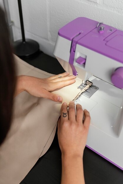 Woman working in her fashion design workshop