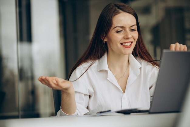 Woman working in office on a computer