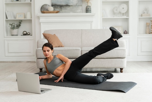 Woman working out alone at home