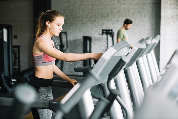 Free photo woman working out on treadmill