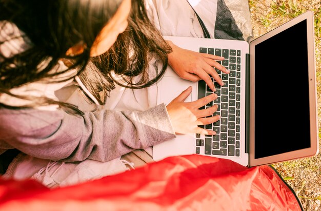 Woman working remotely and using laptop