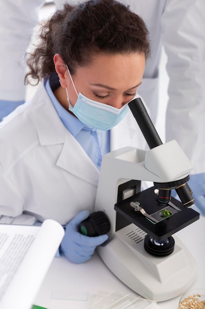 Woman working with microscope