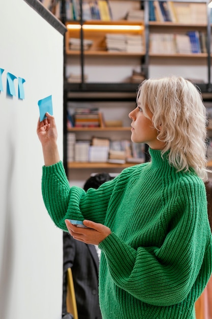 Free photo woman writing business idea