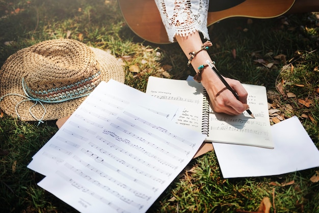 Free Photo woman writing down some lyrics