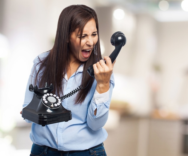 Woman yelling at the phone