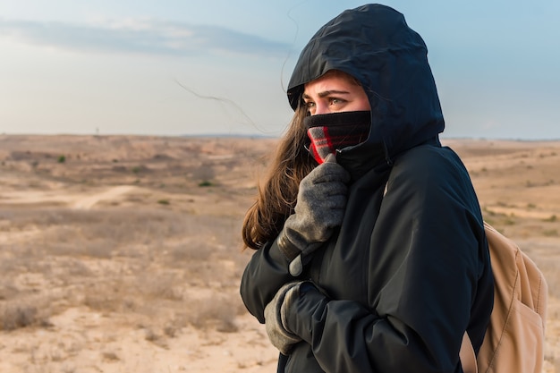 Free photo woman zipped up her jacket to protect herself from cold weather