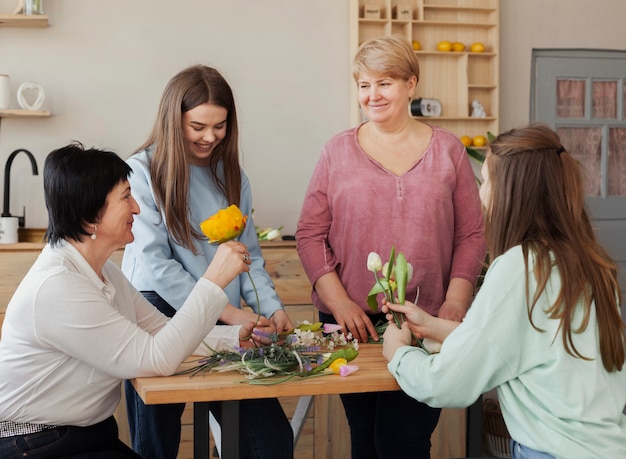 Free Photo women of all ages sitting around the table