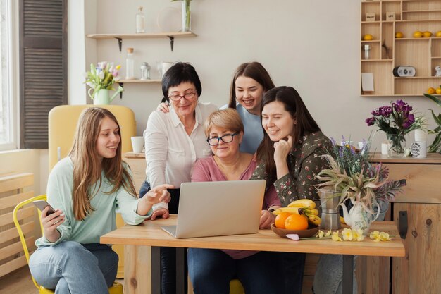 Women of all ages sitting at an office desk