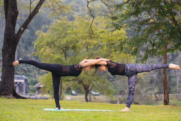 Women are playing yoga at the gym. Exercising.